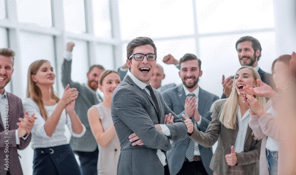 corporate group of employees congratulating each other on the victory