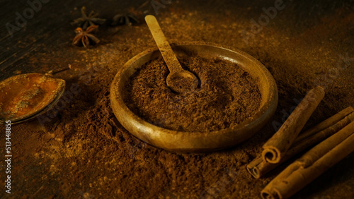 cinnamon ground sticks ceremony cocoa cloves ground coffee spices on wooden table closeup