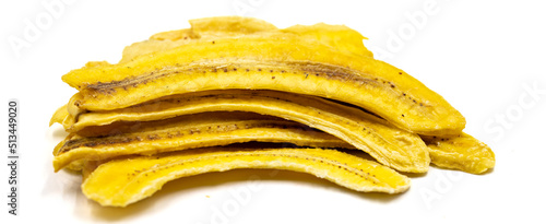 Dried banana slices. Sliced dried banana isolated on white background. Sun-dried fruit. close up. Copy space