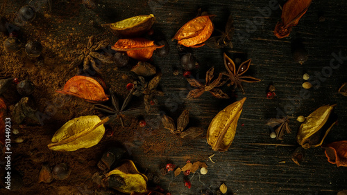 cinnamon ground sticks ceremony cocoa cloves ground coffee spices on wooden table closeup