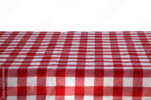 Table with checkered picnic cloth isolated on white