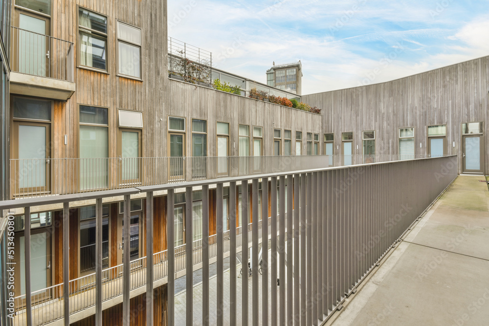 Panoramic view of a modern high tech residential complex made of wood in geometric style Panoramic view of a modern high tech residential complex made of wood in geometric style