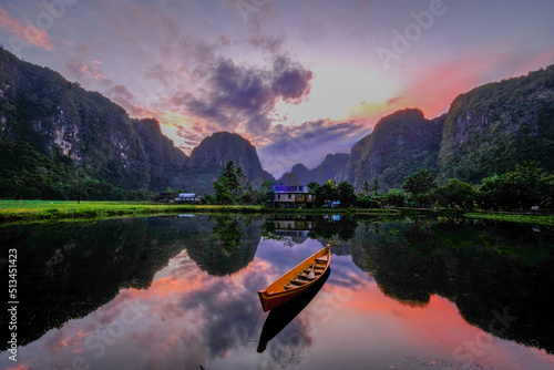 Bild auf Leinwand wallpaper rammang-rammang sulawesi sunrise over the lake