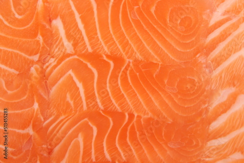 orange background salmon slice texrure ,fish design 