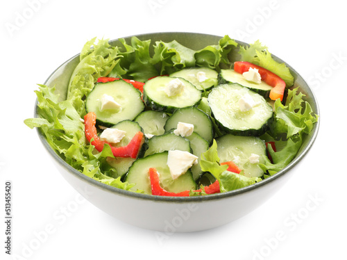 Delicious salad with cucumbers, red bell pepper and feta cheese in bowl isolated on white