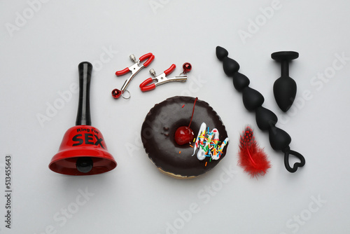 Flat lay composition with sex toys on white background