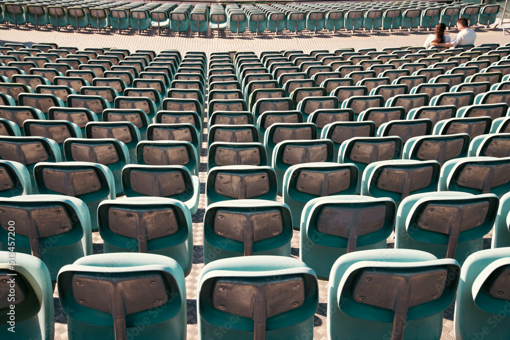 Naklejka premium Empty Plastic Chairs at the Stadium