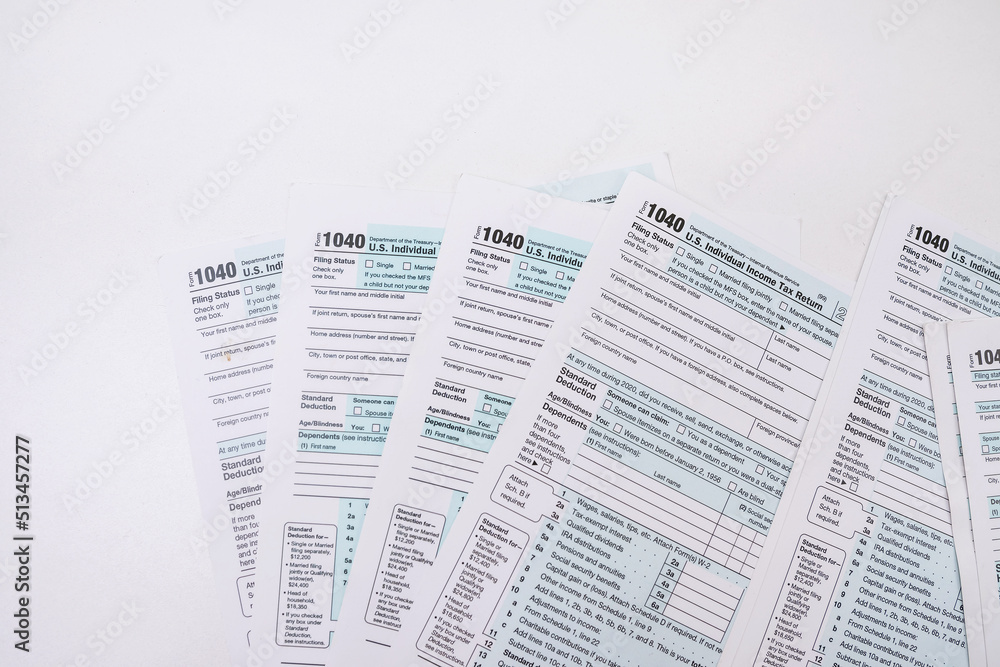 Fototapeta premium empty 1040 individual tax form ready to fill in office desk