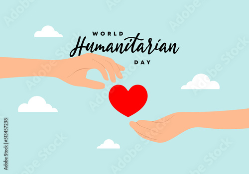 World humanitarian day background with hand give love heart symbol isolated on blue background.