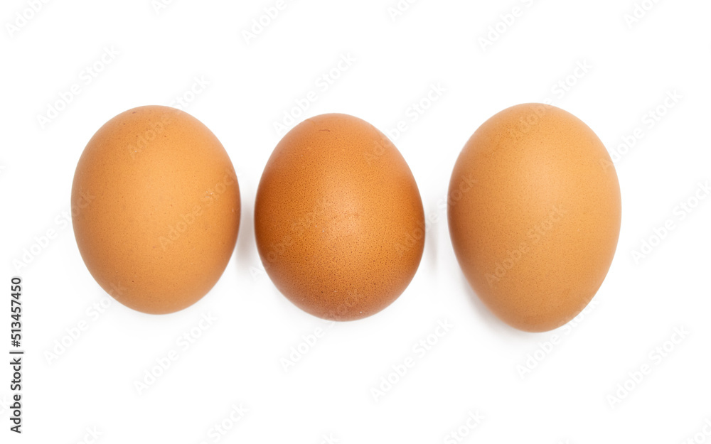 Three chicken eggs isolated on white a background. Three chicken eggs isolated on white a background.