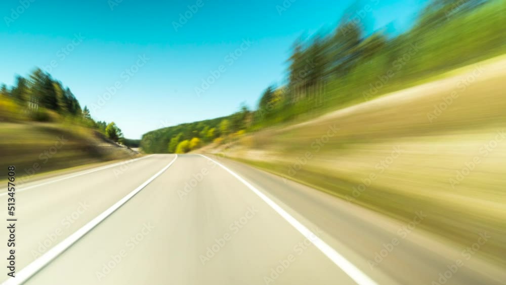 Timelapse of a Speedy Day Drive. View From the Car Windshield to the Country road. Hyperlapse Road Trip Sort of Dashcam POV. Travel Concept Timelapse of a Speedy Day Drive. View From the Car Windshield to the Country road. Hyperlapse Road Trip Sort of Dashcam POV. Travel Concept