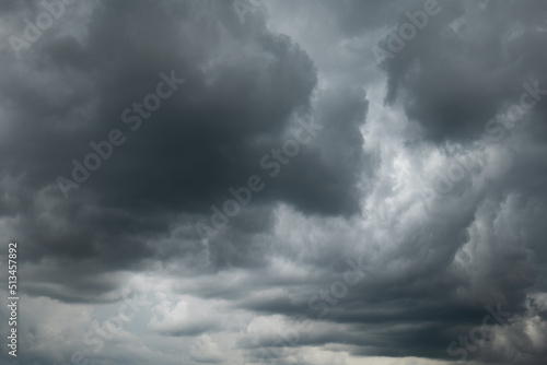 A dramatic dark storm cloudy sky or cloudscape. Wide-angle view, gray clouds, no people
