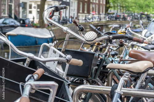 Bicycles parked background. Bikes parking at Amsterdam city center, close up. Netherlands Holland