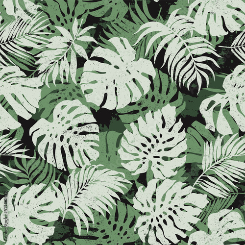 Tropical monstera and palm leaves abstract vector seamless pattern 