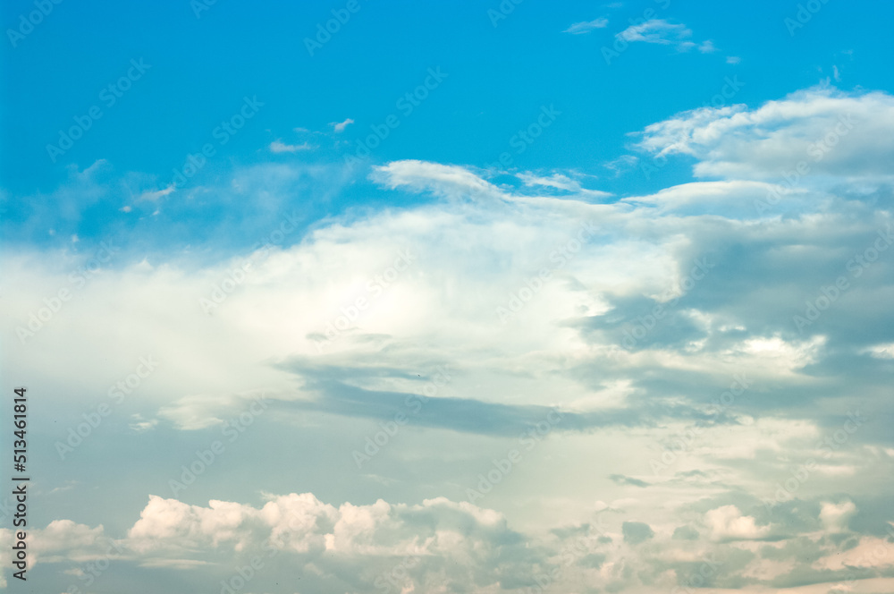 Beautiful cloudscape with abstract shapes. Clouds in the blue sky.