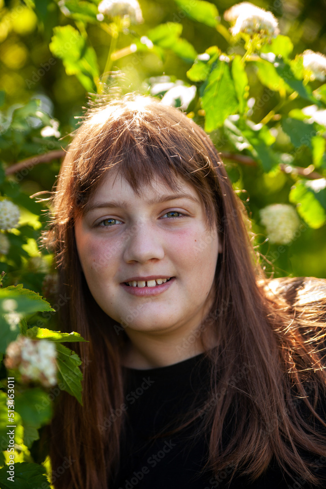 Cute teenage girl outside in summer garden Cute teenage girl outside in summer garden