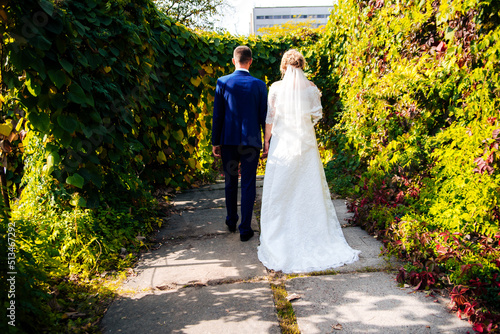 Fotobehang bride and groom walking