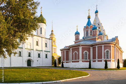 Assumption Cathedral and Church of the Icon of the Mother of God of Tikhvin on Cathedral (Sobornaya) Square of Kolomna Kremlin in Old Kolomna city at summer sunset photo