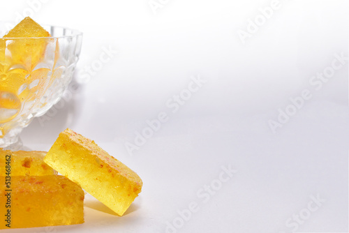 Handmade marmalade with citruses on a white background, isolated. Crystal vase with marmalade.