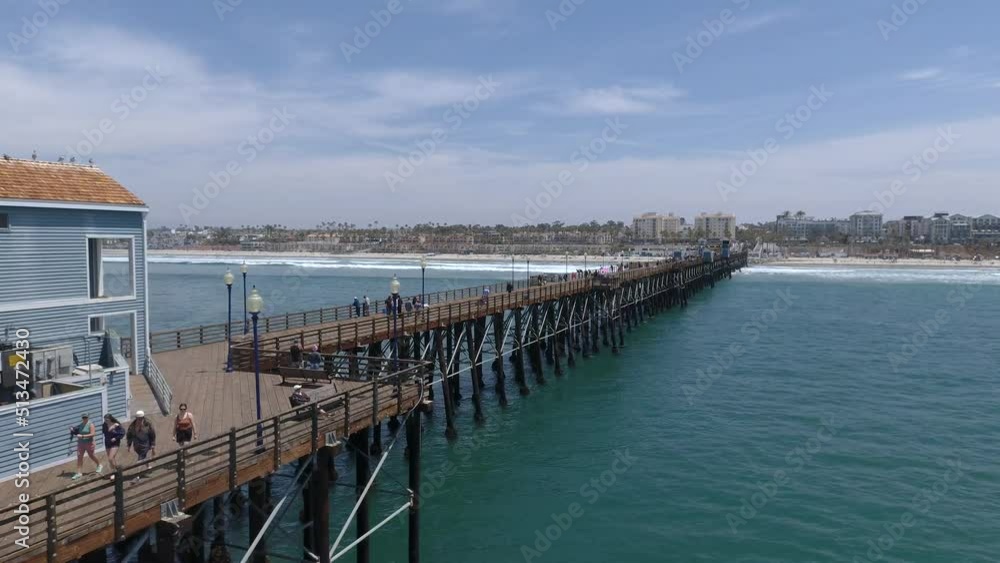 Strolling Along Pier at Oceanside Beach on Beautiful Sunny Day • HD Aerial Footage from Drone Shot in Horizontal • San Diego, California Strolling Along Pier at Oceanside Beach on Beautiful Sunny Day • HD Aerial Footage from Drone Shot in Horizontal • San Diego, California
