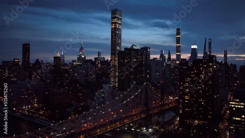 dusk view of NYC skyline descending next to Ed Koch Queensboro Bridge photo