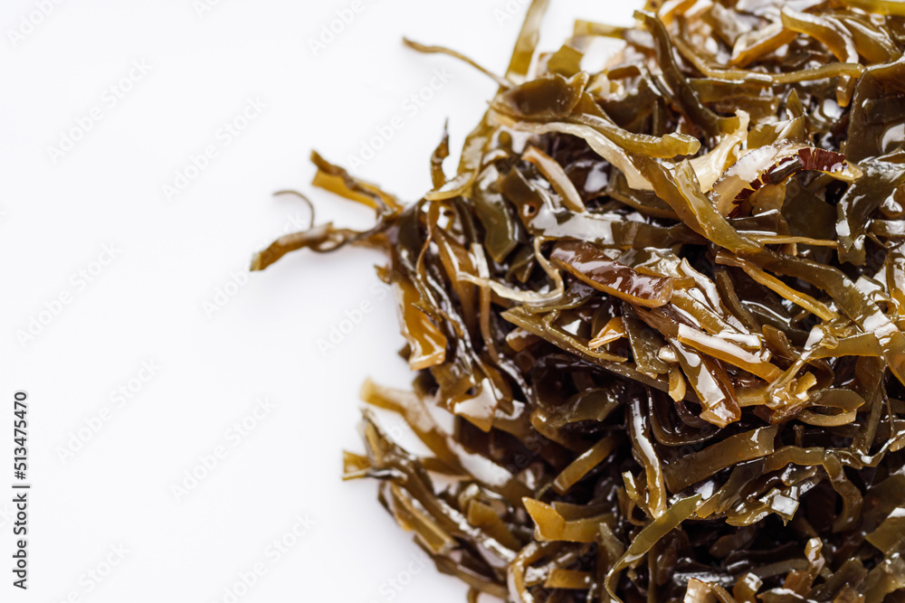 seaweed salad on a white acrylic background