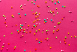 Background of colorful candies. Rainbow topping for topping ice cream and cakes. top view. copy space.	
