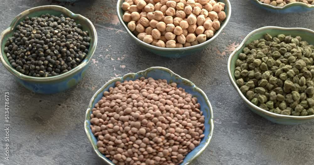 Dry chickpea and lentils in bowls. Legumes assortment, table spin. Dry chickpea and lentils in bowls. Legumes assortment, table spin.