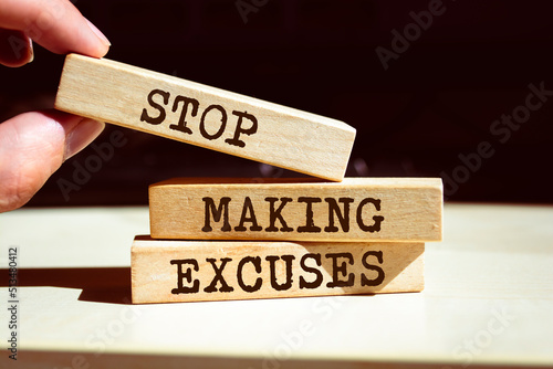 Wooden blocks with words 'Stop making excuses'.