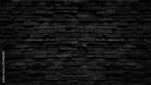 Old black stone brick wall texture for background or tiles floor decorative design.