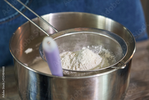 flour in a sieve close-up. homemade baking. home baking