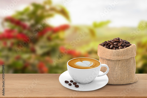 Hot coffee cup with coffee beans on the wooden table and the plantations background