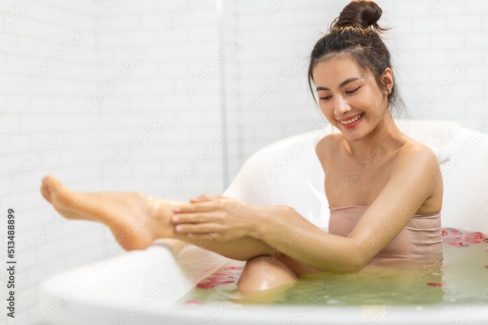 Portrait of smiling of happy beauty pretty asian woman clean fresh healthy white skin spa treatment enjoy relaxing taking shower and bath with bubble foam spa in bathtub at bathroom Portrait of smiling of happy beauty pretty asian woman clean fresh healthy white skin spa treatment enjoy relaxing taking shower and bath with bubble foam spa in bathtub at bathroom