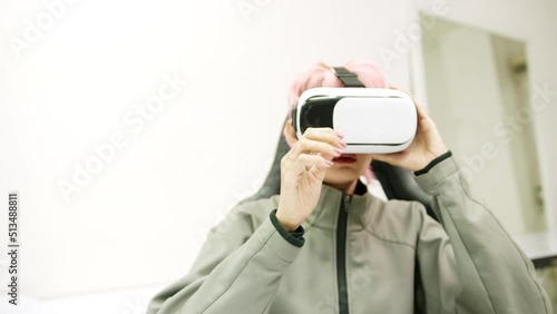 Female used VR Headset at Living Room