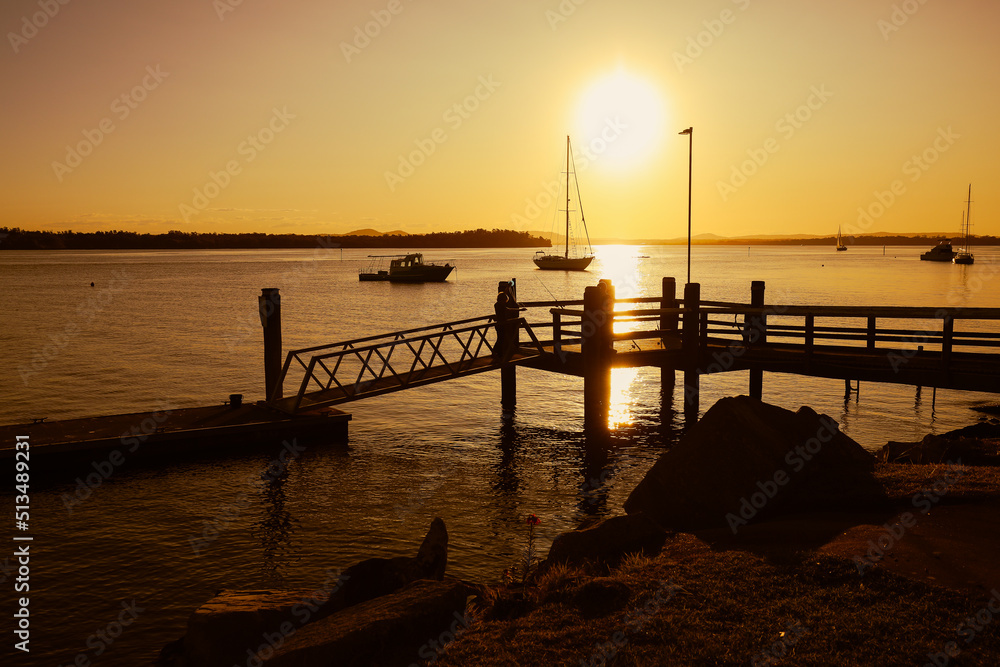 Vibrant afternoon sunset over jetty at Iluka, NSW Australia Vibrant afternoon sunset over jetty at Iluka, NSW Australia