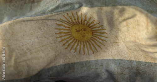Old Argentina Flag waving at wind. Loop