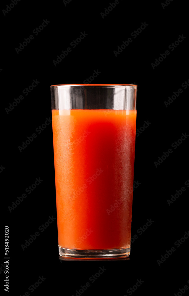 Tomato or carrot juice in a tall glass glass on a white background. Tomato or carrot juice in a tall glass glass on a white background.