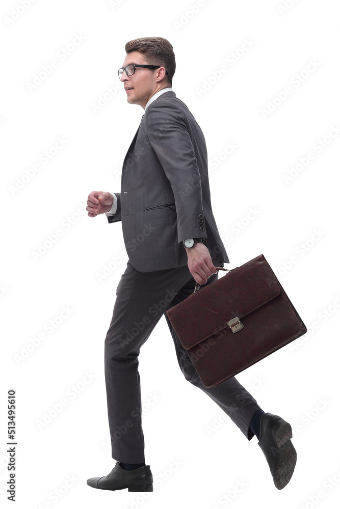side view. confident businessman with leather briefcase stepping forward side view. confident businessman with leather briefcase stepping forward
