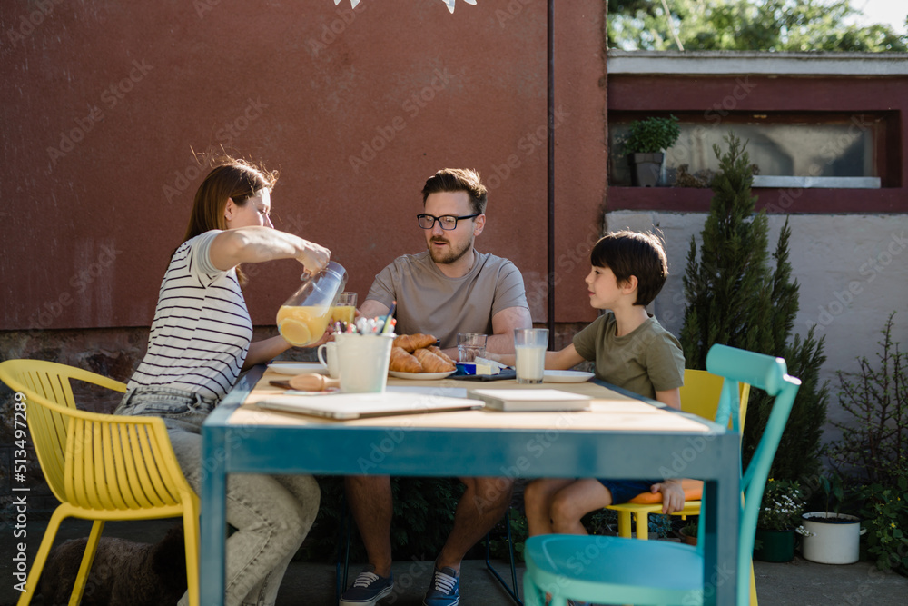 family breakfast together at home in backyard family breakfast together at home in backyard