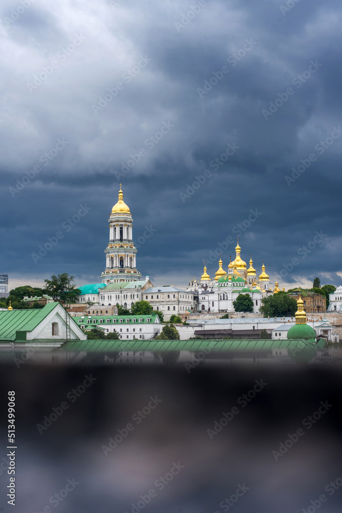 Kyiv Pechersk Lavra under a dark stormy sky