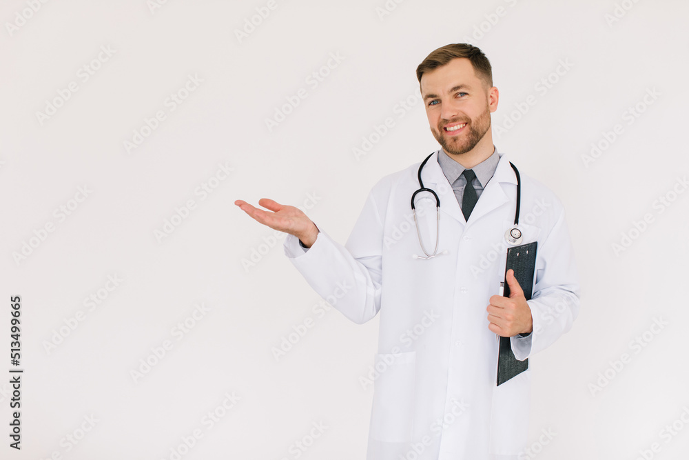 Happy male doctor with a folder shows something in the copy space on a white background Happy male doctor with a folder shows something in the copy space on a white background