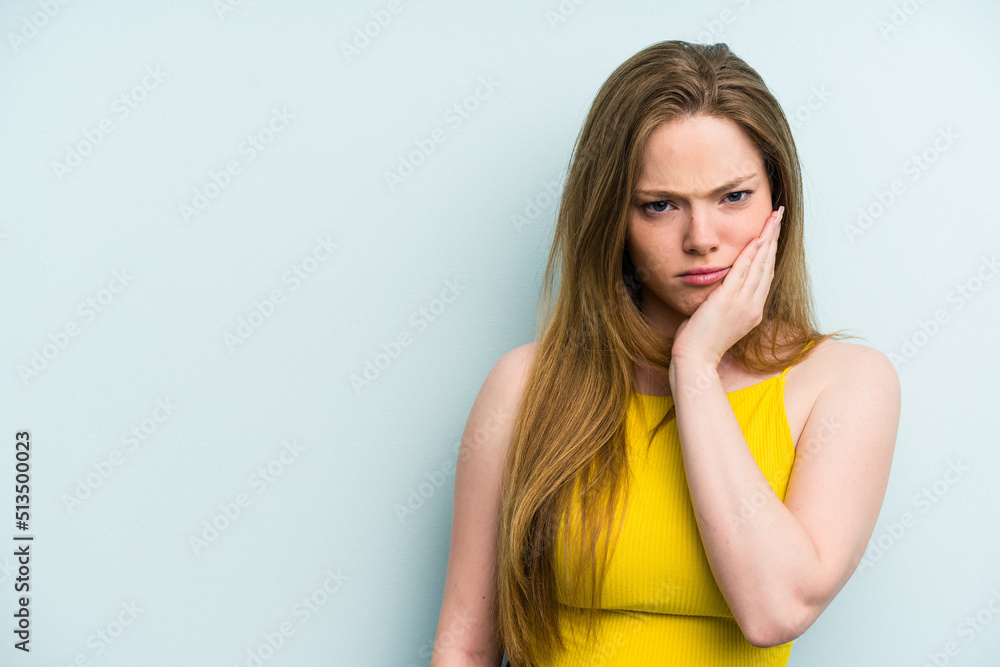 Young caucasian woman isolated on blue background who feels sad and pensive, looking at copy space. Young caucasian woman isolated on blue background who feels sad and pensive, looking at copy space.