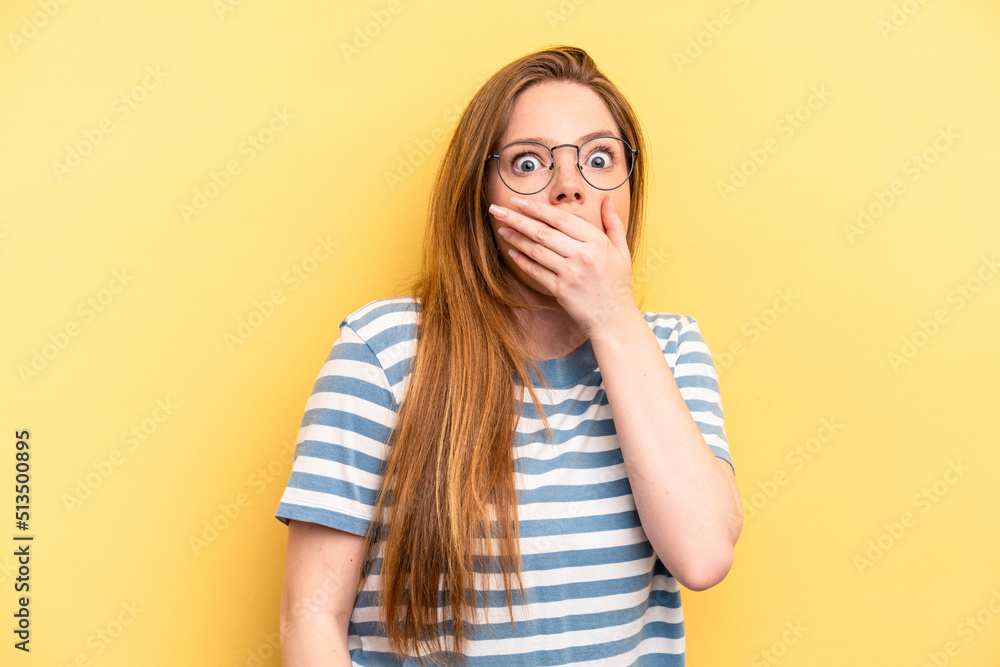 Young caucasian woman isolated on yellow background scared and afraid. Young caucasian woman isolated on yellow background scared and afraid.
