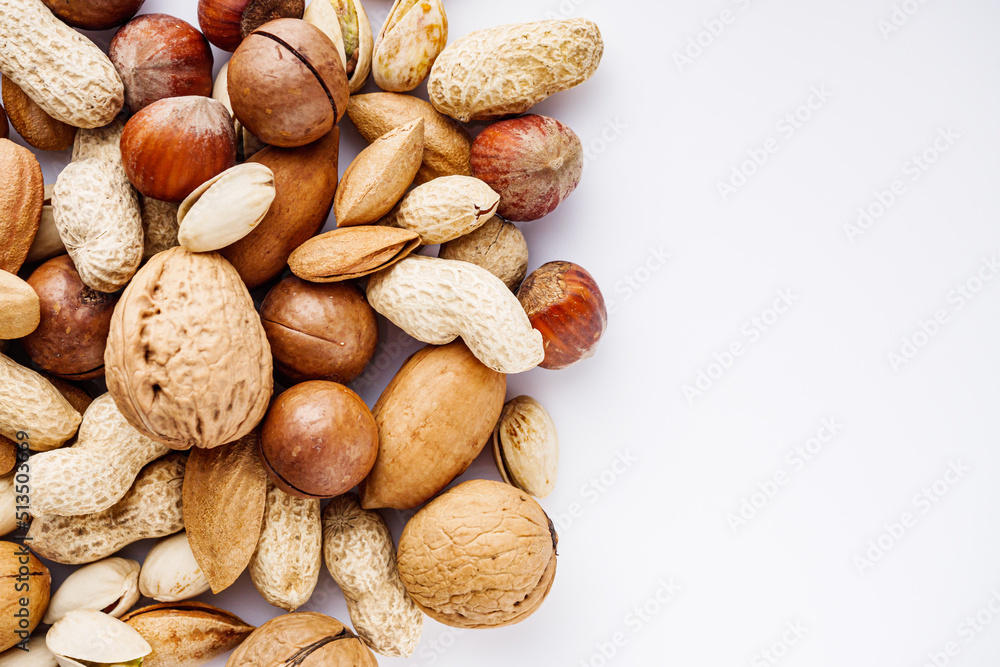 set of different nuts on a white acrylic background set of different nuts on a white acrylic background