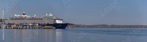 Panorama view of the Stockholm harbor Frihamnen, old free port, with cruise ships moored and the long bridge Lidingöbron in the background a sunny summer day in Stockholm photo