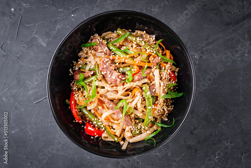 delicious chinese fried noodles on a black background