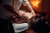 Woman on a massaging, chiropracting table, treatment of body and skin tension.