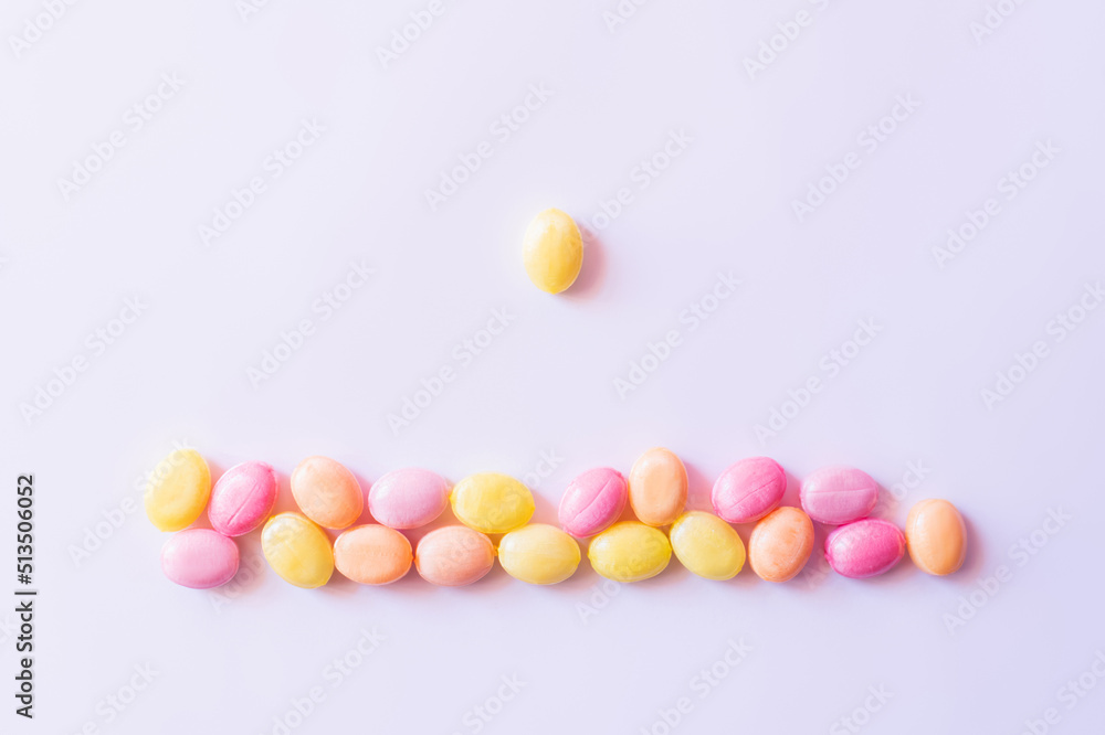 Top view of candy near colorful sweets on white background. Top view of candy near colorful sweets on white background.