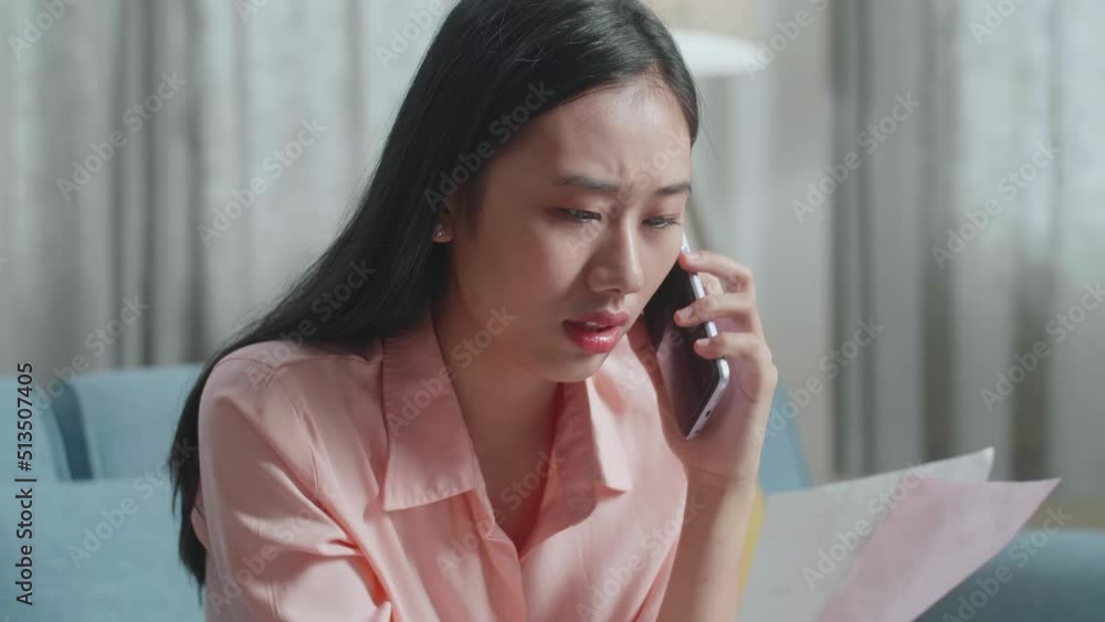 Close Up Of Asian Woman Answering The Call Then Having Headache While Looking At The Bill In Hand
Close Up Of Asian Woman Answering The Call Then Having Headache While Looking At The Bill In Hand