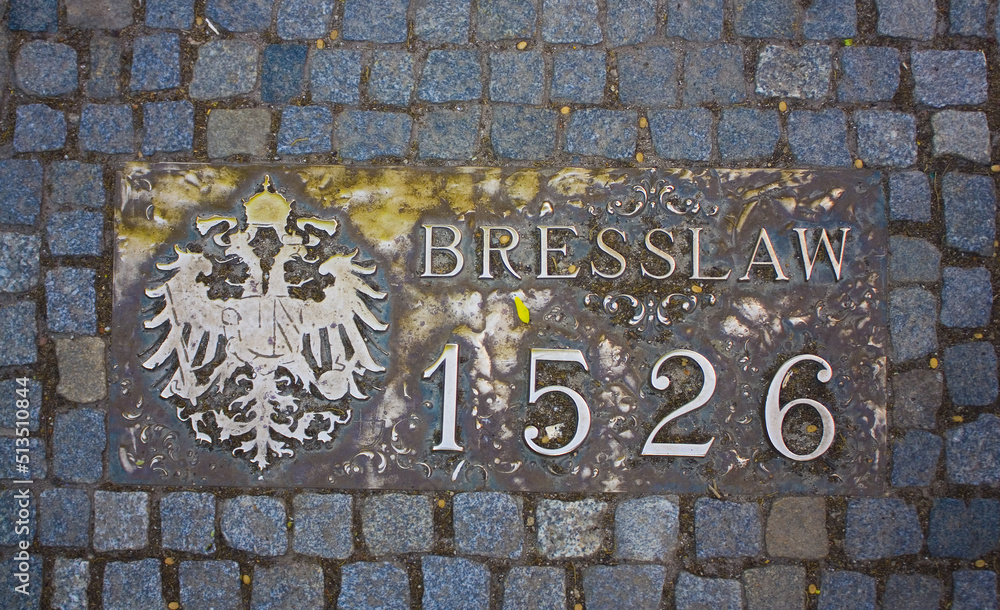 Beautiful manhole bronze cover with historical date 1526 in Wroclaw	